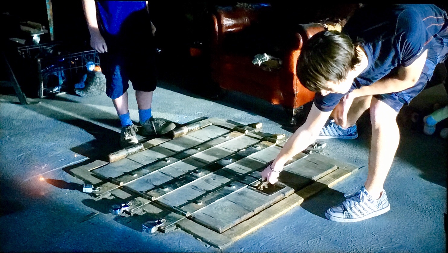 Our hero, Dane (Chris Massoglia) tries to open his hole.